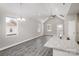 Inviting living room showcasing neutral walls, gray wood floors, and natural light at 220 Shannonhouse W St, Shelby, NC 28152