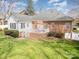 Spacious backyard featuring a combination of brick and vinyl siding and inviting back patio at 2713 Firethorn Ct # 48, Gastonia, NC 28056