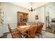 Traditional dining room with wooden table, chairs, and a decorative china cabinet at 2713 Firethorn Ct # 48, Gastonia, NC 28056