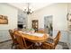 Dining area with wooden table and chairs, adjacent to the living room and kitchen at 2713 Firethorn Ct # 48, Gastonia, NC 28056
