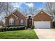 Charming brick home with a well-manicured lawn, two-car garage, and inviting curb appeal at 2713 Firethorn Ct # 48, Gastonia, NC 28056