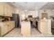 A full shot of a spacious kitchen showing the double islands, sink, range, microwave, and stainless refrigerator at 2713 Firethorn Ct # 48, Gastonia, NC 28056