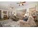 Spacious living room with fireplace, ceiling fans, and views into the kitchen and dining area at 2713 Firethorn Ct # 48, Gastonia, NC 28056