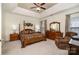 A spacious main bedroom suite with a four-poster bed, sitting area, and neutral decor at 2713 Firethorn Ct # 48, Gastonia, NC 28056