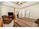 A view into the main bedroom suite from the bathroom showing the four-poster bed and sitting area at 2713 Firethorn Ct # 48, Gastonia, NC 28056