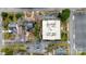 Top-down aerial view of a brick apartment building, adjacent parking lot, and neighboring homes at 300 N Fulton St # 12, Salisbury, NC 28144