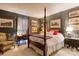 Stunning bedroom featuring a four-poster bed, desk, chair, and unique decor at 300 N Fulton St # 12, Salisbury, NC 28144