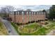 Brick apartment building with a beautiful backyard and a sidewalk at 300 N Fulton St # 12, Salisbury, NC 28144