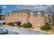 Charming brick apartment building with awning-covered entrance and well-manicured landscaping at 300 N Fulton St # 12, Salisbury, NC 28144