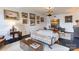 Bright living room with neutral rug, vintage couch, a collection of paintings, and dark hardwood floors at 300 N Fulton St # 12, Salisbury, NC 28144