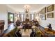 A cozy living room with warm lighting, vintage furniture and an inviting atmosphere with views to other rooms at 300 N Fulton St # 12, Salisbury, NC 28144