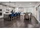 Modern kitchen with island, stylish pendant lighting, stainless steel appliances, and adjacent dining area at 3022 Bramble Hedge Rd # 3269, Indian Trail, NC 28079
