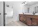 Bathroom featuring double vanity with wood cabinets and tile floors at 3030 Swallowtail Ln, Kannapolis, NC 28083