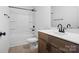Bathroom with wood cabinets, white countertop, and a tub-shower combination at 3030 Swallowtail Ln, Kannapolis, NC 28083