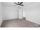 Neutral bedroom featuring carpet flooring, a ceiling fan, and white painted walls at 3030 Swallowtail Ln, Kannapolis, NC 28083