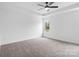 Cozy bedroom with a ceiling fan, plush carpet, and natural light at 3030 Swallowtail Ln, Kannapolis, NC 28083