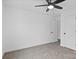 A bright bedroom features neutral walls, carpet, and a ceiling fan at 3030 Swallowtail Ln, Kannapolis, NC 28083