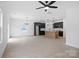 Spacious living area featuring hardwood floors, a modern kitchen, and recessed lighting at 3030 Swallowtail Ln, Kannapolis, NC 28083