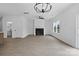 Bright living space with a fireplace, large windows, and hardwood flooring at 3030 Swallowtail Ln, Kannapolis, NC 28083