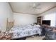 Spacious bedroom with a floral bedspread, a ceiling fan, and bright window offering a comfortable and inviting retreat at 355 Branchwood Rd, Statesville, NC 28625