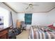 Functional bedroom featuring a ceiling fan and natural light, providing a simple and comfortable space at 355 Branchwood Rd, Statesville, NC 28625