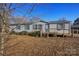 Charming single story home featuring a wooden ramp and stairs for easy access at 355 Branchwood Rd, Statesville, NC 28625