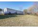 Exterior view of the home displaying a well-maintained lawn at 355 Branchwood Rd, Statesville, NC 28625