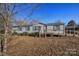 Inviting single-story home with a functional ramp and mature trees, offering easy access and a serene outdoor setting at 355 Branchwood Rd, Statesville, NC 28625