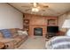 Inviting living room with fireplace, bookcase, and comfortable couches at 355 Branchwood Rd, Statesville, NC 28625