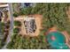 Stunning aerial view of the home surrounded by lush greenery and a serene pond at 4009 Beechwood Spring Ln, Belmont, NC 28012