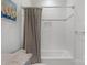 Bright bathroom features a shower with subway tiles and a neutral chevron shower curtain at 4009 Beechwood Spring Ln, Belmont, NC 28012