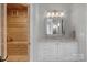 Bathroom with a sauna, white vanity with granite countertop, and modern lighting at 4009 Beechwood Spring Ln, Belmont, NC 28012