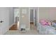 Hallway with bedroom featuring charming decor and a unicorn pillow at 4009 Beechwood Spring Ln, Belmont, NC 28012