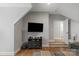 Bonus room featuring hardwood floors, sloped ceilings, and a large TV at 4009 Beechwood Spring Ln, Belmont, NC 28012