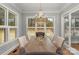 Elegant dining room with a chandelier, natural light, and a wooden table at 4009 Beechwood Spring Ln, Belmont, NC 28012