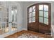Stunning entryway with glass paneled double doors and wood flooring at 4009 Beechwood Spring Ln, Belmont, NC 28012