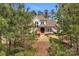 Charming home exterior framed by lush trees and mature landscaping at 4009 Beechwood Spring Ln, Belmont, NC 28012