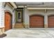 Attached garage with stone accents and convenient side door access at 4009 Beechwood Spring Ln, Belmont, NC 28012