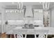 Gourmet kitchen with custom white cabinets, granite countertops, and stainless steel appliances at 4009 Beechwood Spring Ln, Belmont, NC 28012