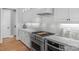 Close up of a kitchen with granite counters, subway tile backsplash, and a stainless steel range at 4009 Beechwood Spring Ln, Belmont, NC 28012