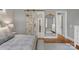 Bedroom with barn door, gold full-length mirror and access to other rooms at 4009 Beechwood Spring Ln, Belmont, NC 28012