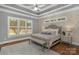 Serene bedroom with tray ceiling, plush bedding, and ample natural light at 4009 Beechwood Spring Ln, Belmont, NC 28012