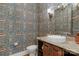 Charming powder room with floral wallpaper, stylish mirror, and vessel sink at 4009 Beechwood Spring Ln, Belmont, NC 28012