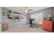 Bright bedroom with guitars mounted on the wall, a ceiling fan, and an orange dresser for storage at 4035 W Sandy Trl, Fort Mill, SC 29707