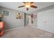 Spacious bedroom features a ceiling fan, closet, and artistic decor, perfect for personalization at 4035 W Sandy Trl, Fort Mill, SC 29707