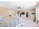 Spacious bedroom with walk-in closets, a ceiling fan, and large bed at 4035 W Sandy Trl, Fort Mill, SC 29707