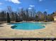 Large community pool surrounded by a spacious patio and a fence at 4035 W Sandy Trl, Fort Mill, SC 29707