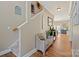 Inviting hallway with wood floors and staircase leading to the upper level of the home at 4035 W Sandy Trl, Fort Mill, SC 29707