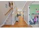 Inviting hallway with wood floors and staircase leading to the upper level of the home at 4035 W Sandy Trl, Fort Mill, SC 29707