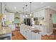 Bright kitchen features white cabinets, granite countertops, stainless steel appliances, and a center island at 4035 W Sandy Trl, Fort Mill, SC 29707